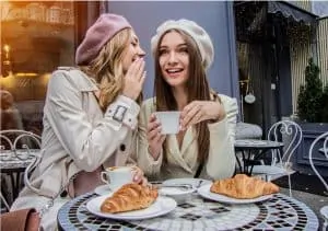 women with dermaplaning eating croissants